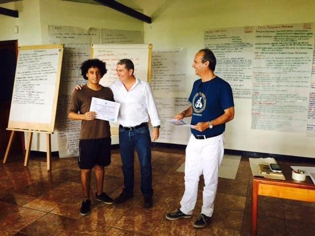 Ecuadorian student Paul Medranda receives Mangrove Finch Conservation Workshop participation certificate from CCREG Director Eliécer Cruz and CDF Executive Director Dr Arturo Izurieta.