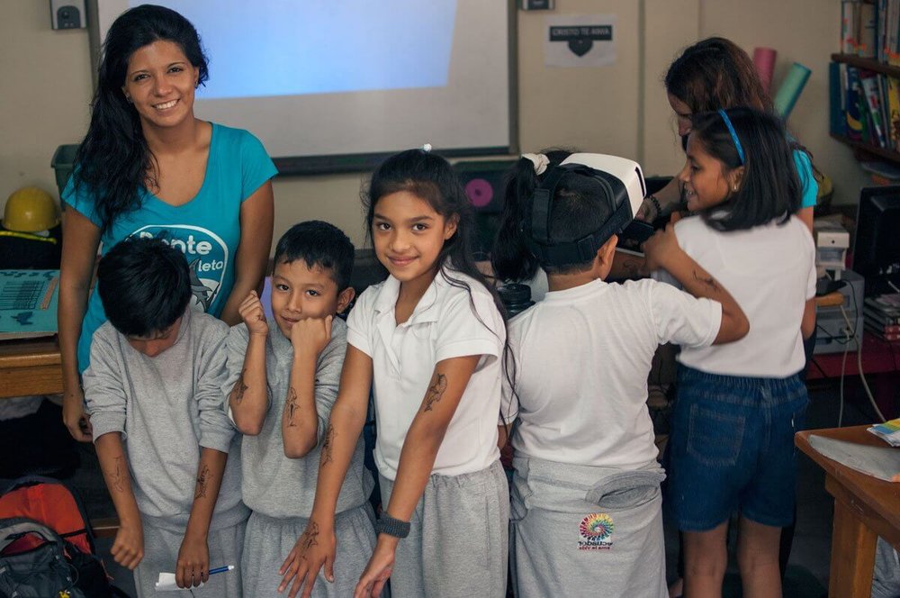 Daniela Vilema and Beatriz Mariño with children after shark workshop.