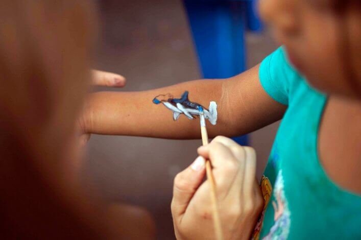 Painting shark tattoos of the different species we study at CDF.
