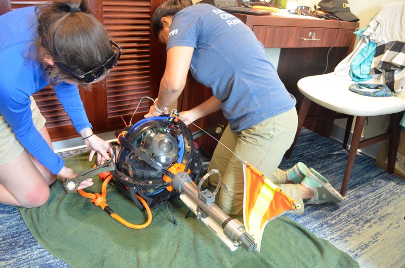 Pauline Sepa (CDF) and Margaret Sullivan (MIT) preparing deep-sea camera system for deployment