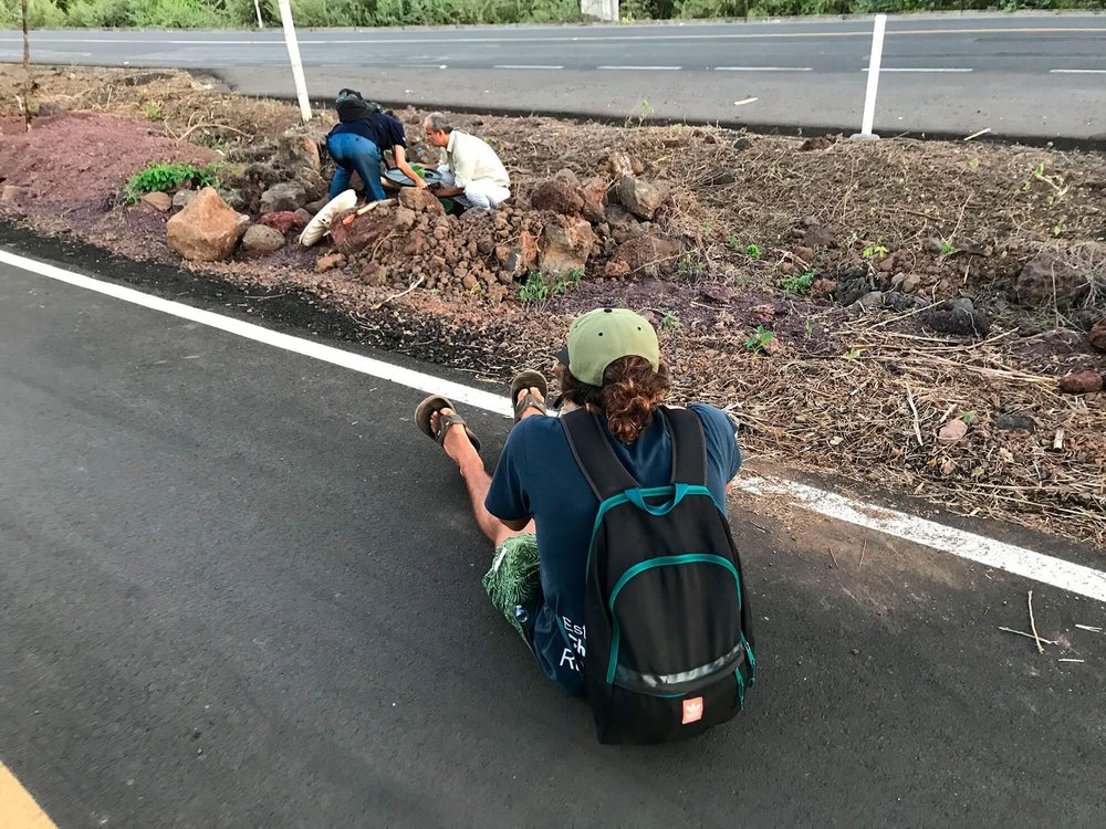 Volunteer Andrés Cruz taking photos during a community event of tree-planting on Santa Cruz Island.